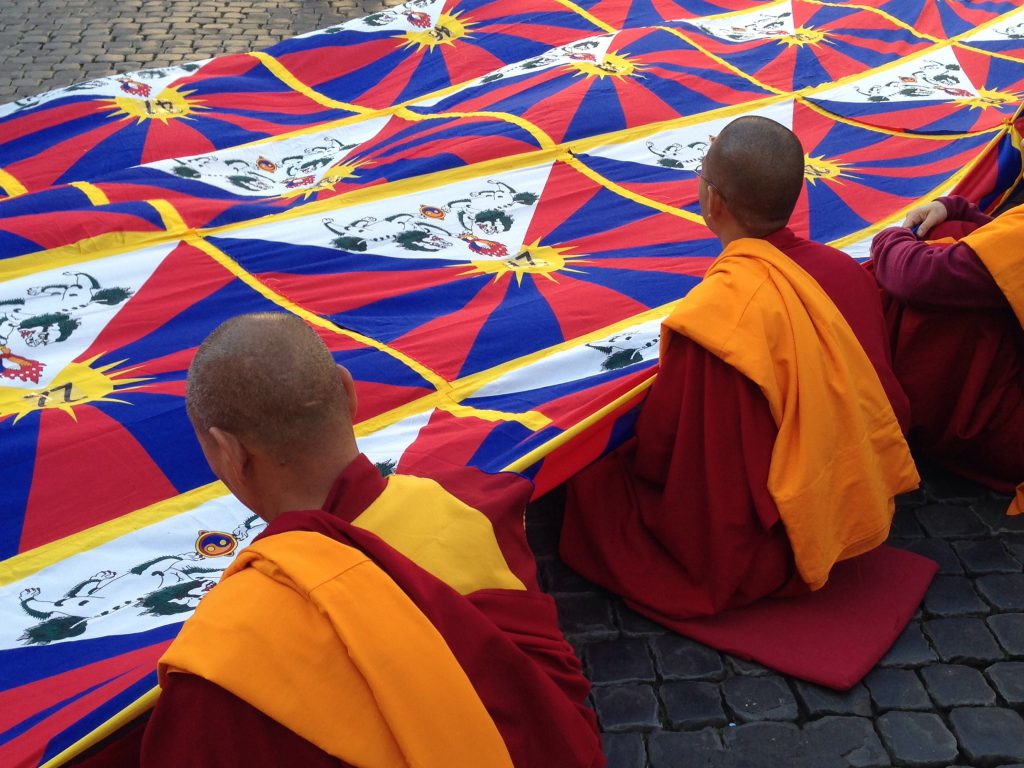 Tibetan Monks with flag, Lhasa, 48 hour is lhasa