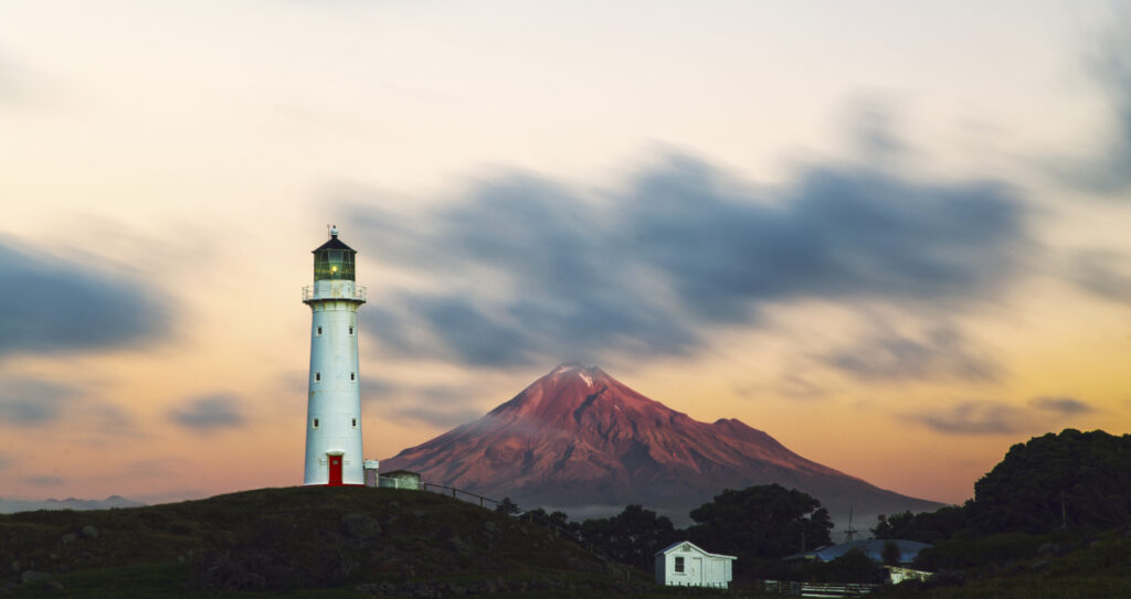 Cape Egmont Lighthouse with Mt Taranaki sunset in the background