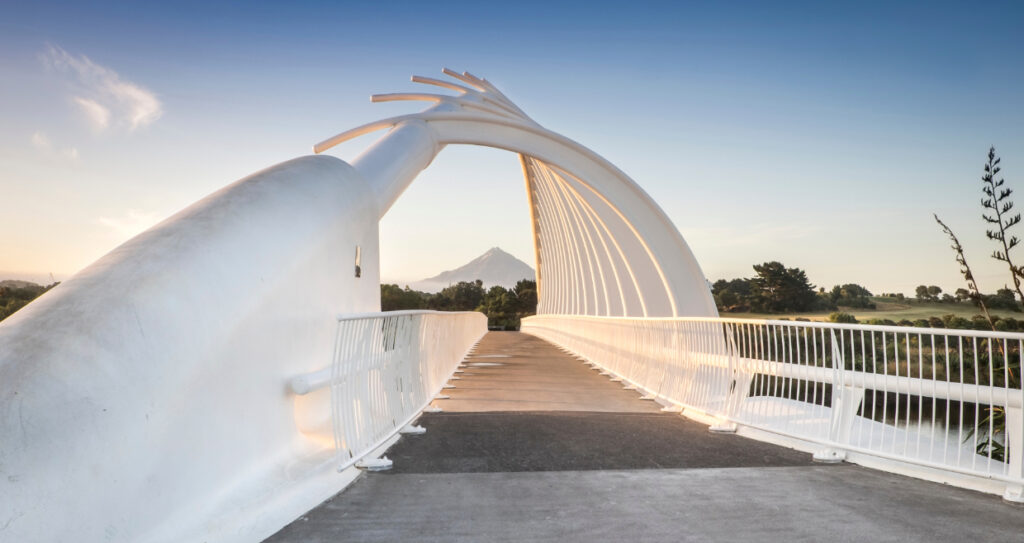 Beautiful white Te Rewa Rewa Bridge with Mt Taranki in the far distance